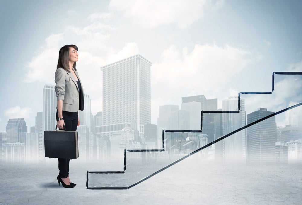 Business person in front of a staircase, city on the background-1