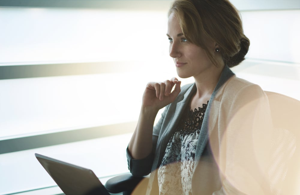 Filtered portrait of an executive business woman writing on a glass wall at sunset-2