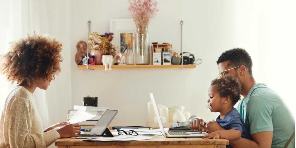 parents-using-computer-while-sitting-with-boy-picture-id1175060780